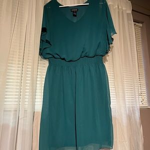Flowy lightweight emerald dress with flutter sleeves and gathered waist.